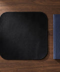 2 Pack Tough Fireproof Mat With High Heat Resistant Carbon Felt Blanket on wooden surface with pen and notebook.