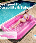 Woman relaxing on Inflatable Tanning Pool Lounger With Pillow 70 By 46 Inches Personal Water Filled Float for backyard sunbathing.