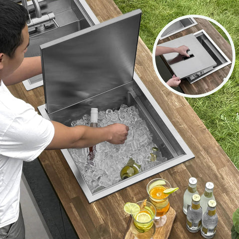 Badass Hella Insulated Workstation Sink For Outdoor Kitchen Bar Station With Deep Stainless Bowl Includes Heavy Duty Lid Commercial Grade Strainer And Cutting Board Built Sick, shown with ice and drinks.