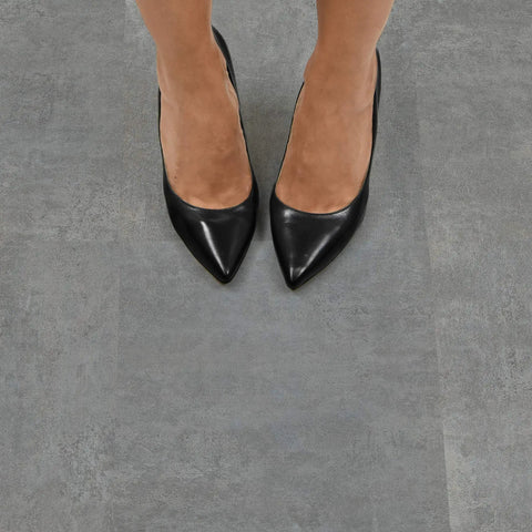 Feet on Grey Tundra Peel And Stick Floor Tiles For Easy DIY Flooring Transformation With Self Adhesive Vinyl Tile That Looks Like Real Stone