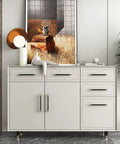 White dresser with brushed satin gold brass finish T bar cabinet handles set of 10 with electroplated matte black accents.