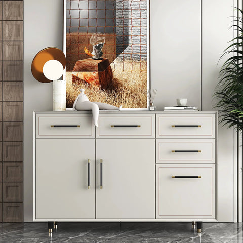 White dresser with brushed satin gold brass finish T bar cabinet handles set of 10 with electroplated matte black accents.