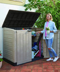 All Weather Heavy Duty Outdoor Storage Shed Made From Resin Plastic For Forty Two Cubic Feet Of Easy Patio Garden Tool Organization In Earthy Brown Shade with open lid.