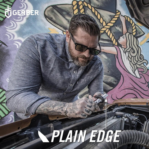 Man using Jukebox EDC Folding Pocket Knife With Straight Edge Flipper Blade for car maintenance with mural background.