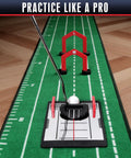 Magnetic Putting Mirror With Golf Gates Training Aid demonstrating alignment and swing plane feedback on practice green mat.