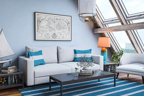 Modern living room with beige sofa, blue accents, wooden coffee table, and large windows, featuring elegant decor elements.
