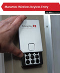 Hand using Wireless Keyless Garage Entry System With PIN Access For Up To Four Doors No Key Needed One Button Close Quick Setup