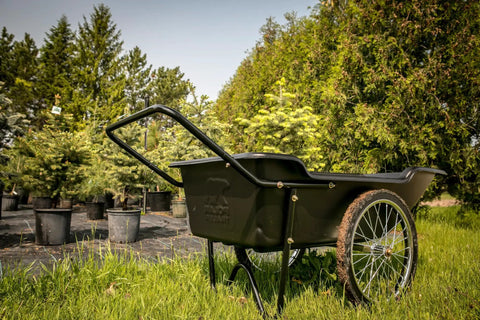 Beefy Heavy Duty Utility Cart With 10 Cubic Feet Tub And 400 Pound Load Capacity With Flat Free Wheels in a garden setting