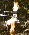 Traditional Arrow Holder With Vented Retainer For Archery Gear on a wooden recurve bow in a forest setting, Made In USA