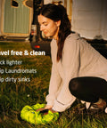 Heavy Duty Travel Laundry Sack Featuring Slick Inner Washboard Grooves Keeps Your Everyday Threads Fresh Camping Trips RV Adventures And Hotel Stays in use outdoors.