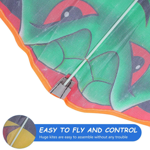 Close-up of green giant snake kite with gold foil, showing handmade animal modeling and easy-to-fold design.