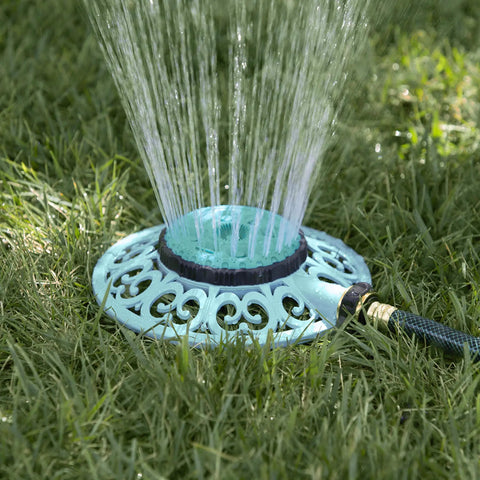 Sprout Metal 8 Pattern Sprinkler With Quick Connect Adapter Amazon Bundle In Gooseberry Green on grassy lawn in use