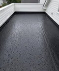 Top Shelf Epdm Rubber Roofing And Waterproofing Membrane Featuring 27.5 Mil Thickness For Badass Waterproof Protection On Flat Roofs Easy Zero Fuss Install With One Massive Sheet Measuring 15 Feet By 20 Inches Rock Solid Leak Proof Seal Every Time on a flat roof covered in water droplets.