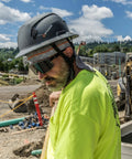 Premium Safety Glasses With Ansi Z87 Plus Impact Rating Featuring Anti Fog Vented Polycarbonate Lenses and a lightweight non slip grey frame on a worker.