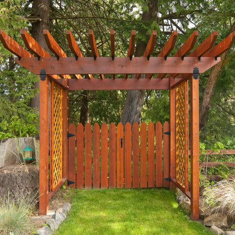 Rock Solid Iron Thumb Latch With Matte Black Galvanized Steel Finish Six Inch Throw Heavy Duty Gate Closure Lock installed on wooden garden gate.