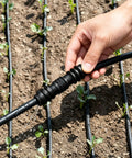 Get This Awesome 8 Pack Of 1/2 Inch Hose Connectors For Your Garden, Soaker Hoses, And Washing Machine! These Tough Molded Plastic Fittings Are Perfect For Quick Repairs, Fixing Leaks, And Extending Water Lines Anywhere Around Your Yard Or Home System. black 1/2 inch plastic hose connector on irrigation line