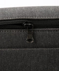 Close-up of dark gray zipper tab from Six Pack Detachable Zipper Pulls Replacement Kit For Jackets Pants Coats Shoes Suitcases And Backpacks Durable Dark Gray Zipper Tabs For Quick Repairs And Easy DIY Fixes on fabric surface.