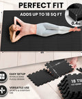 18 Piece EVA Interlocking Foam Floor Tiles Gym Mat Set With Edge Pieces For Total Floor Protection In Home Gym And Garage Workout Areas 12.6x12.6x0.4 Inches Puzzle Mats shown in use, covering 18 sq ft, in anthracite color. Woman lying on mat.