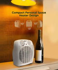 Dual Watt Personal Heater With 750 And 1500 Watts, Fast Warmth, Adjustable Thermostat on desk next to wine bottle
