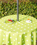60 Inch Round Outdoor Tablecloth With Umbrella Hole And Zipper, Waterproof Heavy Duty Oxford Fabric, Green Polka Dot on Table