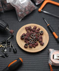 Pro Grade 890 Piece Sanding Drum Set with rods, drill chucks, and sanding grits on display for grinding and finishing projects.