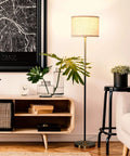 Emery LED Floor Lamp With Drum Shade, Tall Mid Century Standing Light, brass finish in modern living room decor scene.