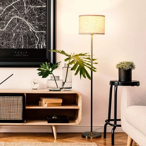 Emery LED Floor Lamp With Drum Shade, Tall Mid Century Standing Light, brass finish in modern living room decor scene.