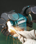 Heavy Duty 250 Watt Bench Grinder Featuring Dual Illuminated Work Lights And Rock Solid Base For smooth metal grinding and tool restoration in use.