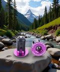 Purple Aluminum Bike Bar End Caps For 15 To 20.5 Mm Handlebar Diameters Universal Fit For MTB And Road Bikes shown on rocks beside a river.