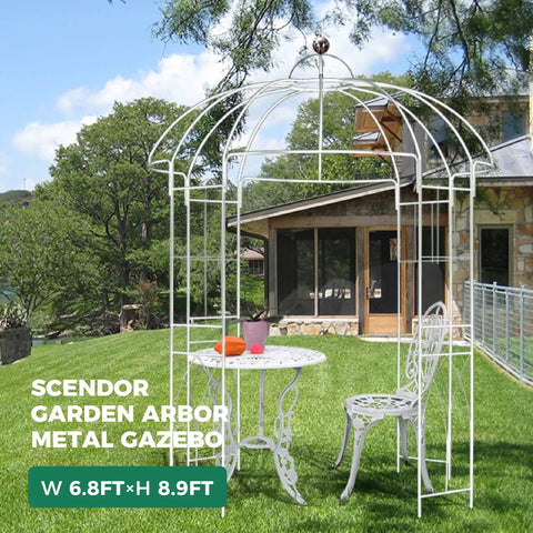 Birdcage Garden Arch Arbor 9 Ft High By 6.8 Ft Wide White Metal Gazebo in garden setting with house backdrop