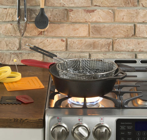 5 Quart Pre Seasoned Cast Iron Deep Skillet With Teardrop And Assist Handles For Oven Stove Grill Or Campfire Cooking Go To Pan For Serious Home Cooks Heavy Duty Build Even Heating Naturally Nonstick Black on stovetop with basket insert