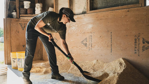 Person using Scoop Shovel With Lightweight Aluminum Head Ergonomic No Slip H Grip D Handle And Fiberglass Core For Moving Feed