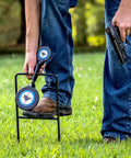 Man setting up Beefy Handgun Rebar Spinner Steel Target For 9mm Through .45 Caliber Pistols, 3/8 Inch Steel With Powder Coat outdoors.