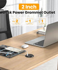 Sleek 2 Inch Desk Power Grommet Outlet With AC Receptacle And Multiple USB Ports on wooden desk with laptop and phone.