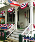 Decorated porch with Three Piece Pleated Fan All American Flags Set 1.5x3 Ft Red White Blue Banners for 4th of July outdoor decor.