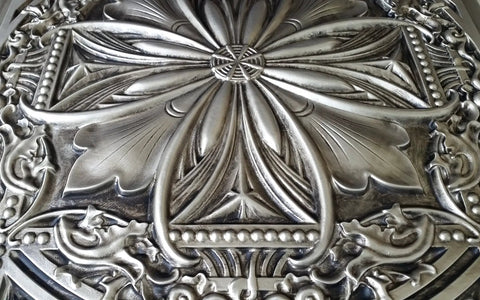 Close-up of Aged Silver 2X2 Ceiling Tiles Pack Of 10 For Drop-In Or Glue-Up Install PVC Panels with vintage tin floral design