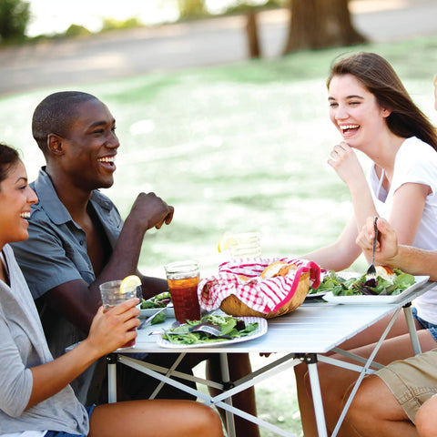 Group dining on Outdoor Folding Table With Aluminum Slat Top And Snap Together Design Seats Four Carry Bag Included