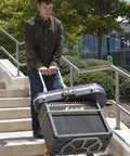 Heavy Duty Wheeled Cart For Everyday Hauls And Quick Moves Sports A Super Tall Grip And Shock Absorbing Wheels navigating stairs with gear.