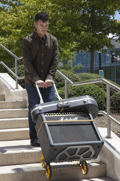 Heavy Duty Wheeled Cart For Everyday Hauls And Quick Moves Sports A Super Tall Grip And Shock Absorbing Wheels navigating stairs with gear.