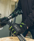 Kickass Heavy Duty Cable Cutter in use, cutting wire with electric tool, showcasing handle and safety features.
