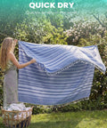 Woman holding Oversized Boho Turkish Beach Towel Blanket Quick Dry Sand Free Jumbo Outdoor Picnic Mat Extra Large XL Navy