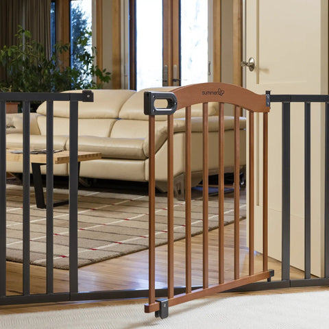 Decorative Walk-Thru Baby And Pet Gate For Openings Up To 60 Inches, 30 Inch Tall With Walnut Wood And Charcoal Metal Accents in living room