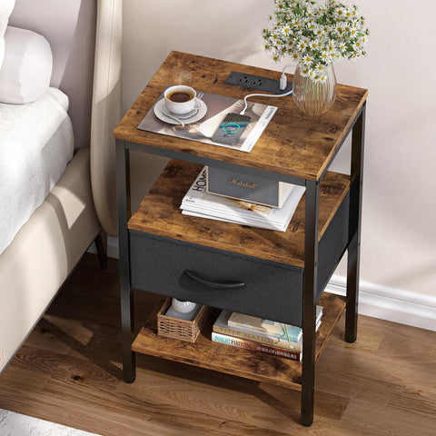 Nightstand With Charging Station And USB Ports, Bedside Table With Adjustable Fabric Drawer, 3 Tier Storage End Table For Bedroom And Living Room in rustic brown and black finish with items on top.