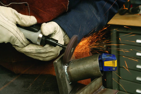 Heavy Duty Pneumatic Die Grinder With 1 Hp Motor And 8000 RPM Straight Shaft in use on metal, sparks flying, precise grinding job.