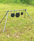 AR500 Steel Gong Target 3 Eighths Inch Thick For Precision Shooting on stand in grassy field