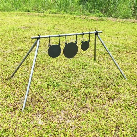 AR500 Steel Gong Target 3 Eighths Inch Thick For Precision Shooting on stand in grassy field