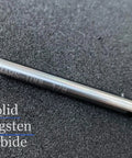 Close-up of a solid tungsten carbide drill bit showing text '1/8' on a textured background, for hardened steel metalwork.