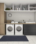 Laundry room with white brick walls featuring a black Multi Purpose Recycled Rubber Floor Mat For Indoor And Outdoor Use, 36 by 60.