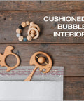 8.25 x 11 White Poly Bubble Mailers With Water Resistant Exterior, Cushioned Padding, Redi Strip Peel Off Closure, 25 Pack For Easy Shipping, featuring cushioned bubble interior with wooden toys on top