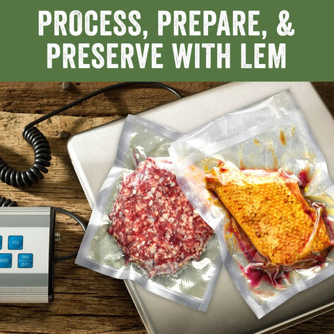 Vacuum-sealed meat portions on a stainless steel digital scale with 330 pound capacity for precise weighing in kitchen or workshop.